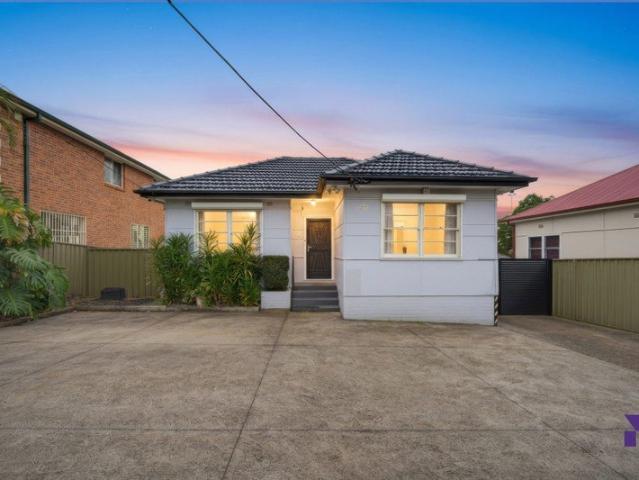 Well maintained family home with a parklike yard, garage with an adjoining rumpus room