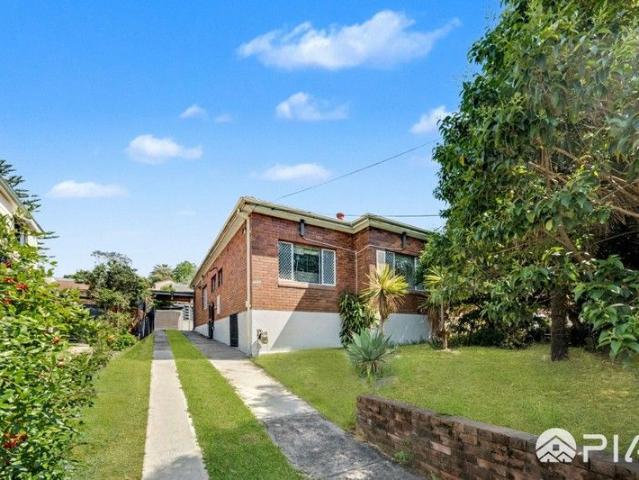 Well Maintained Full Brick Residence with Room to Enhance!
