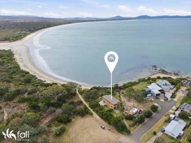 Where the Beach is Your Backyard, and Water Views Welcome You Home