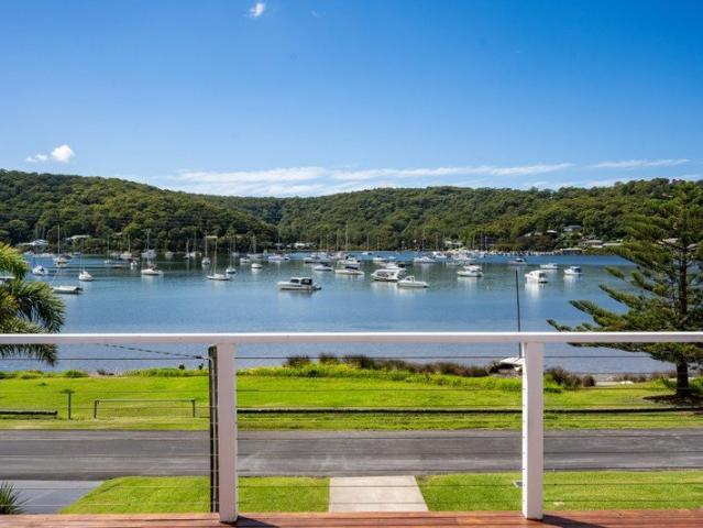 Where timeless charm meets elevated bayside living, set on a prized waterfront reserve