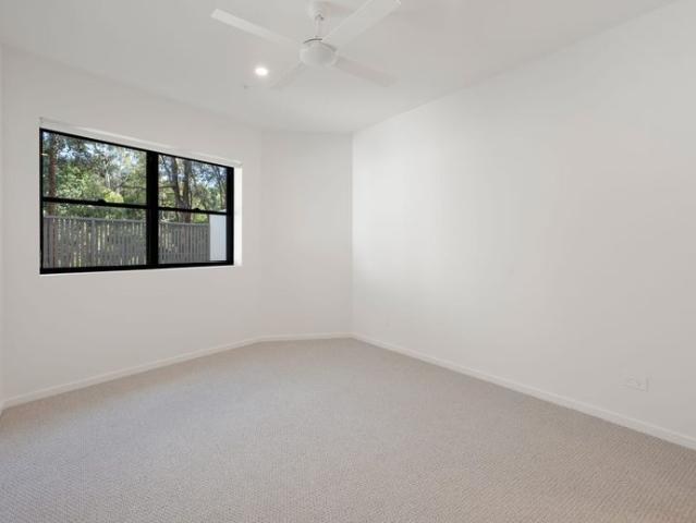 Effortless Coastal Living: Secure Apartment with Garden Oasis
