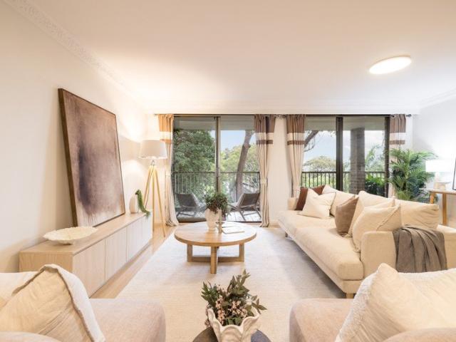 Whisper quiet apartment basks in treetop views while only moments to the CBD