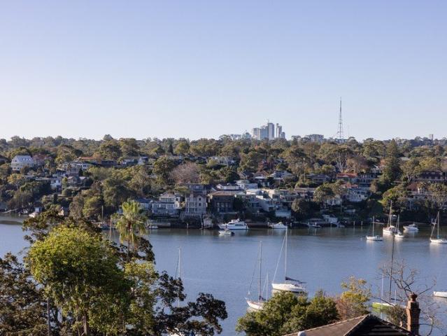 Wide north facing water views, substantial family home with lift, pool & 4 car basement parking