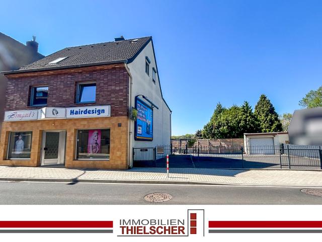 Wohn und Geschäftshaus mit 2 Wohneinheiten, Garage und großzügigem Außenbereich