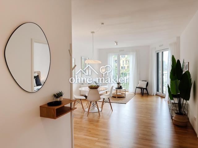 Wohnen am Wasser: Stilvolle 2 Zimmer Wohnung mit Balkon, Wasserblick und Tiefgarage