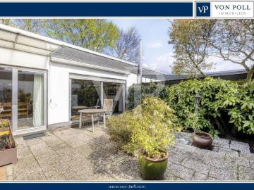 Wohnen im Grünen: Charmanter Bungalow mit Süd Atrium in Feldrandlage