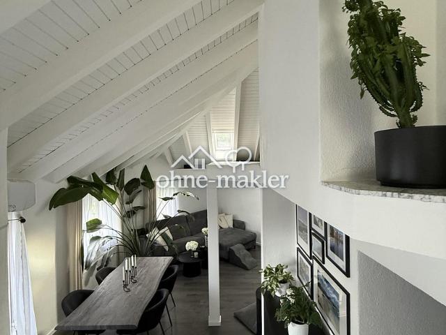 Wohnen mit Charakter – moderne Maisonette mit beeindruckender Dacharchitektur Garten & Pool