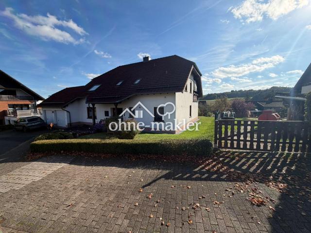 Wohnen mit Weitblick: 4 Zimmer Gartenwohnung mit Kaminofen, überdachter Terrasse und Garage