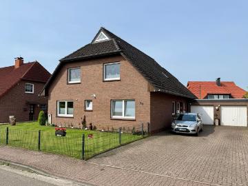Wohnen wie im eigenen Haus – Erdgeschosswohnung mit großem Garten & Garage