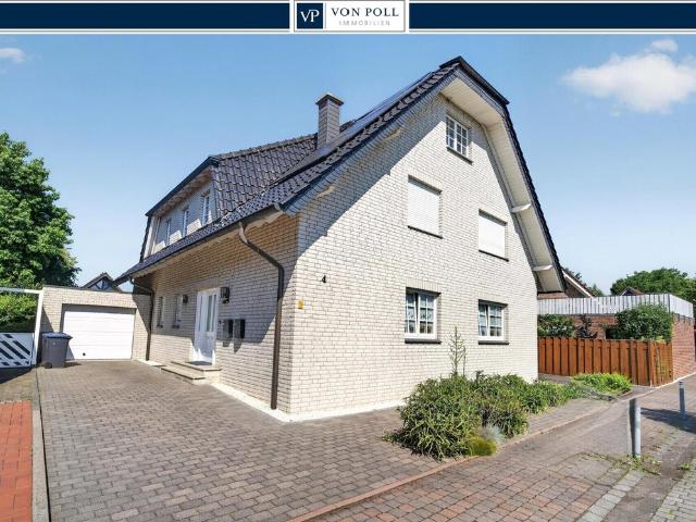 Wohnen wie im eigenen Haus – Große Erdgeschosswohnung mit Traumgarten und Garage im Zweiparteienhaus