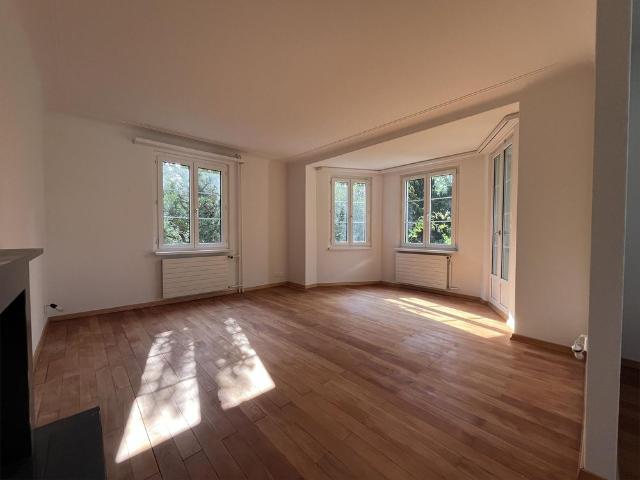 Wohnen wie im eigenen Haus: privater Garten, Cheminée und Altbaucharme