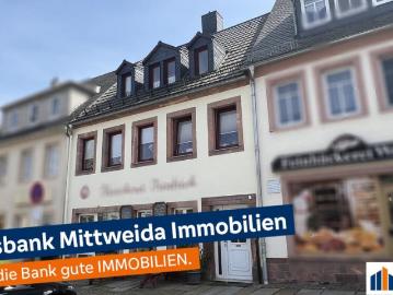 Wohnhaus mit Ladengeschäft im Erdgeschoss in zentraler Lage