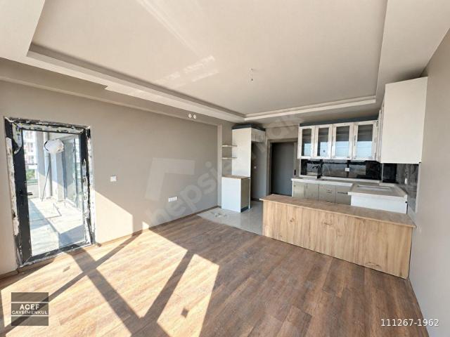 YAPRAÇIK ATAYURT'TA 2+1 AMERİKAN MUTFAKLI 2 BLOKLU SİTEDE SATILIK DAİRE