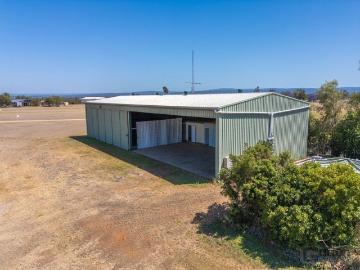 YOUR ADVENTURE HUB AWAITS LARGE HANGAR WITH STUDIO IN PREMIER AIRPARK LOCATION