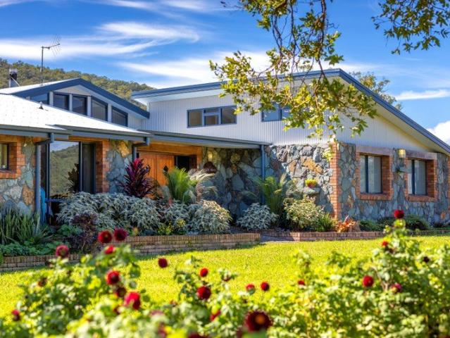 YOUR SLICE OF PARADISE. 97.93 ACRES OF ROLLING HILLS, RIVERFRONT, AND AN ARCHITECTURALLY DESIGNED HOME