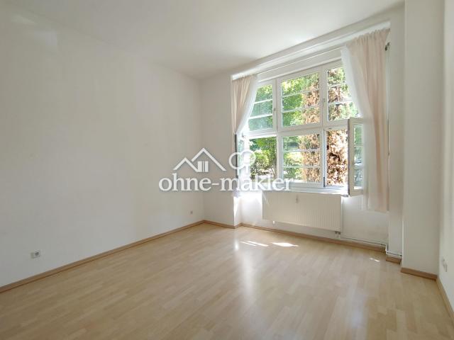 Zentral gelegene Wohnung im Kulturdenkmal mit parkähnlichem Innenhof & Loggia, provisionsfrei!