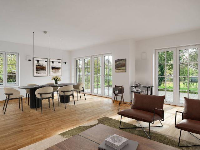 Zeitlose Architektur & nachhaltiger Komfort Schöne Erdgeschosswohnung mit Gartenanteil
