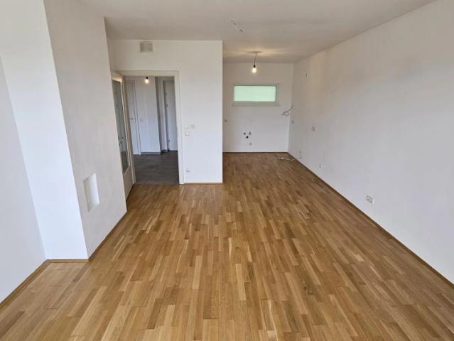 Zu Beginn NUR ca. € 5.000, FB / Geförderte Genossenschaftswohnung im 2. Liftstock mit Loggia & Tiefgaragenparkplatz Top 13