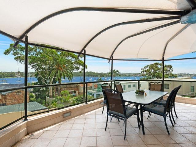 A masterclass in prestige living private deep waterfront estate with iconic views