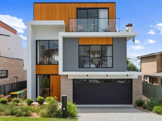 A Masterpiece of Modern Coastal Luxury With 180° Lake & Ocean Views