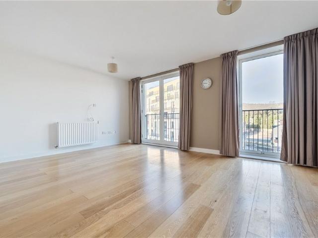 A modern two double bedroom, two bathroom, fourth floor apartment in the popular Bath Riverside development with an underground parking space