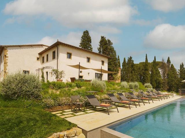 A modern villa in the heart of Tuscany, with spectacular views of the iconic towers of San Gimignano. S