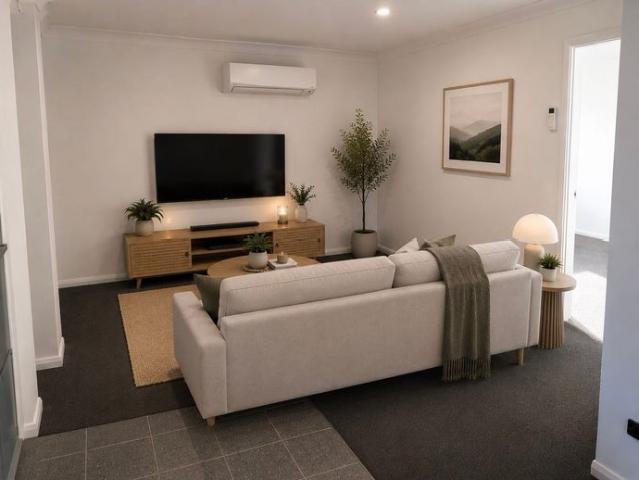 A modern, easy care living unit, in a convenient location