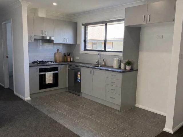 A modern, easy care living unit, in a convenient location