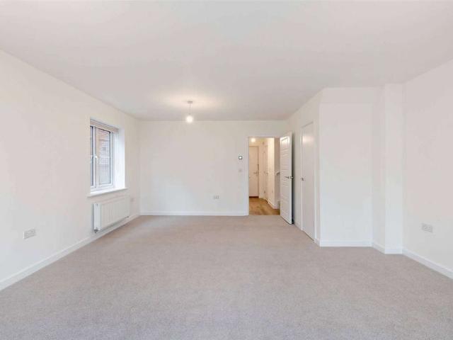 A modern four bedroom family home with private garden and parking