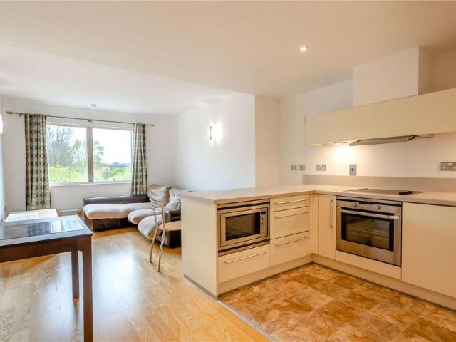 A modern one bedroom apartment with views over the river