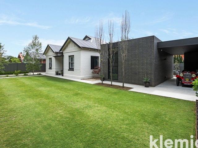 A moody, award winning departure from the mundane on 937sqm with in ground pool and detached pavilion/studio