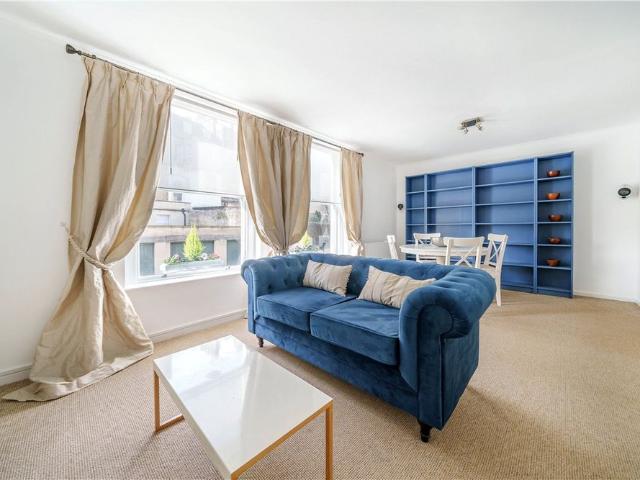 A most wonderfully light and bright two bedroom first floor apartment situated over two floors of a Georgian Townhouse on the corner of Brock Street having lovely views of Royal Victoria Park