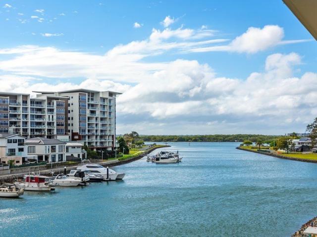 A NEW BENCHMARK IN WATERFRONT LIVING