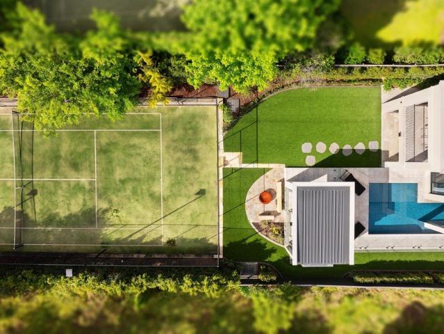 A new statement of distinction, surrounded by poolside and tennis court grounds