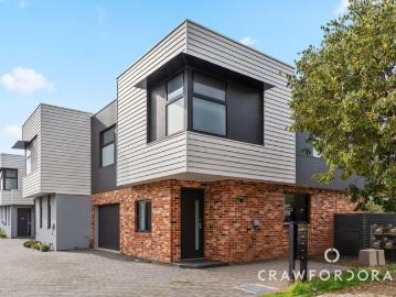 A Next Gen, Lock and Leave Townhouse With the City in Reach