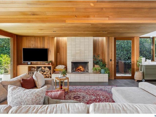 A nod to Mid century with effortless indooroutdoor living, moments from the beach