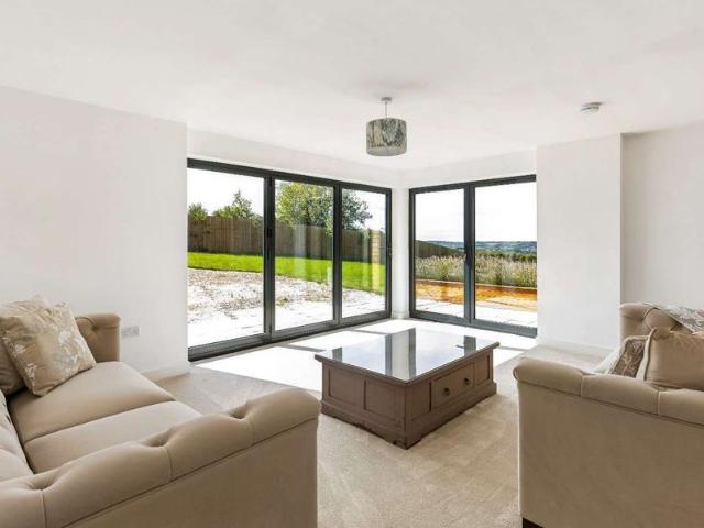 A beautifully converted detached barn style home in a peaceful rural setting, offering spacious and versatile accommodation with far reaching views across the Windrush Valley