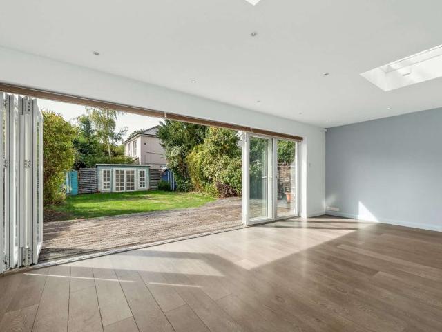 A beautifully extended, detached chalet style home a short walk from Walton on Thames Mainline Station