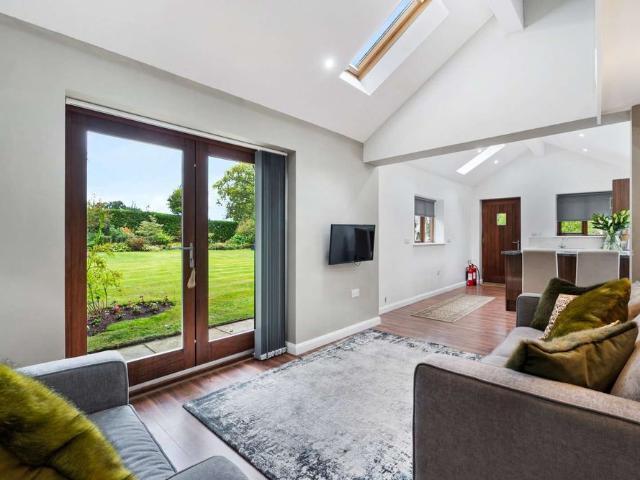 A beautifully extended thatched country home set within 2.18 acres of south facing grounds, offering 4,311 sq ft of characterful accommodation & a self contained annexe