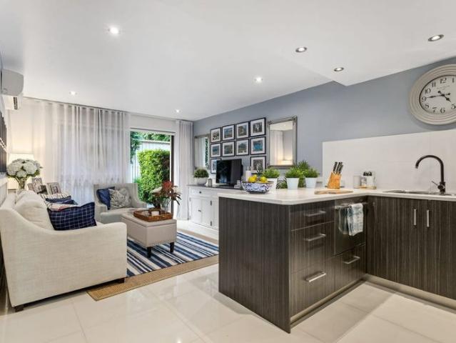 A beautifully presented 2 Bedroom unit nestled in a secure complex only half a block from the Broadwater!