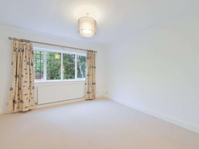 A beautifully presented three bedroom apartment in an attractive Edwardian country house, with patio, parking and garage