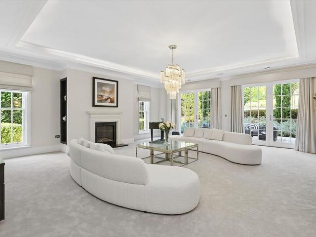 A beautifully presented detached home situated on one of Esher's most sought after residential roads and private gated estates