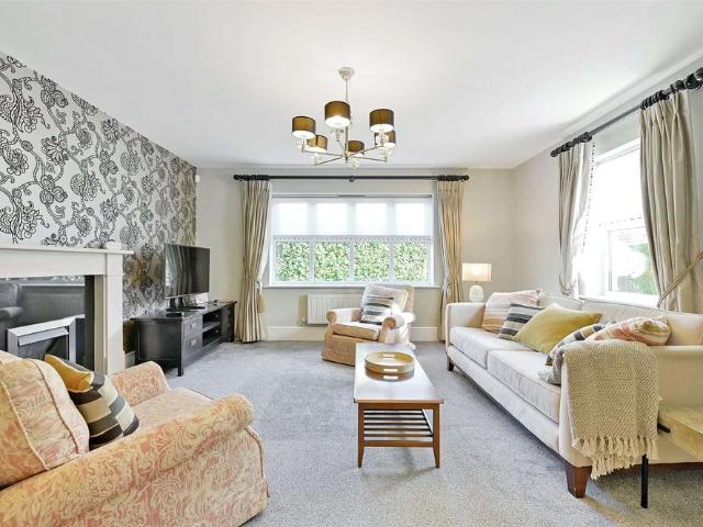 A beautifully presented five bedroom house with courtyard garden, garage and driveway