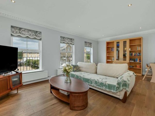 A beautifully presented four bedroom townhouse arranged over four floors, offering spacious living accommodation, a private garden, and an integral garage
