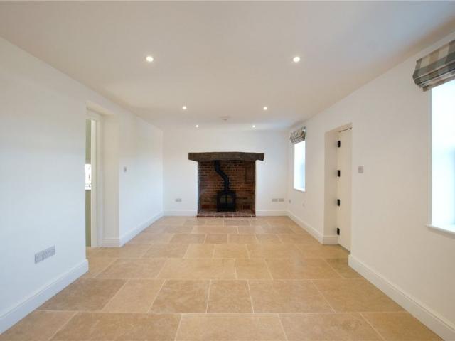 A beautifully refurbished brick and flint cottage combining charming period character with stylish, high quality finishes throughout