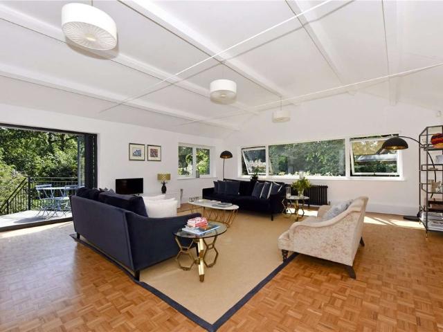A bright and spacious four/five bedroom detached family house situated in a popular residential road just 1.1 miles from Oxshott station and close to Cobham's finest schools