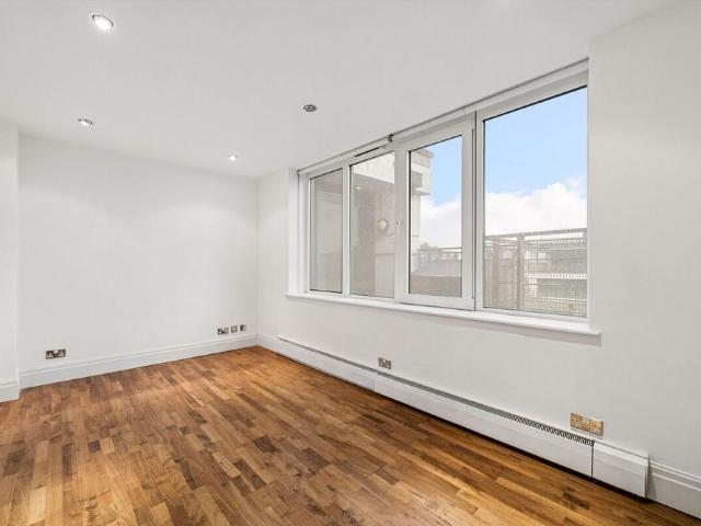 A bright and spacious three bedroom duplex apartment with a spectacular wraparound terrace and private roof level balcony, offering over 1,280 sq ft of accommodation