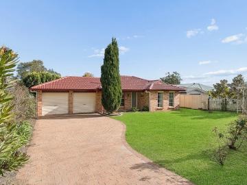 A Bright Future Awaits in this Lovely Home and Garden Oasis