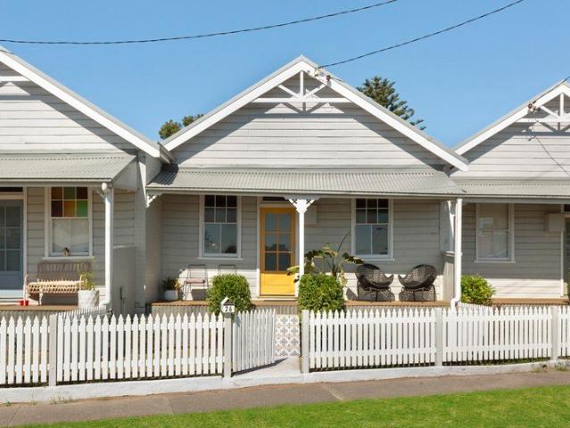 A Bright Little Beauty Behind the Picket Fence