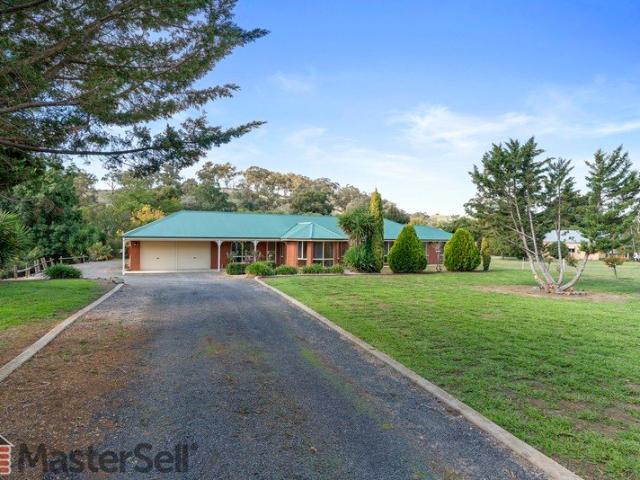 A Captivating Creek side Lifestyle on 1.9 Acres Just Minutes from Town